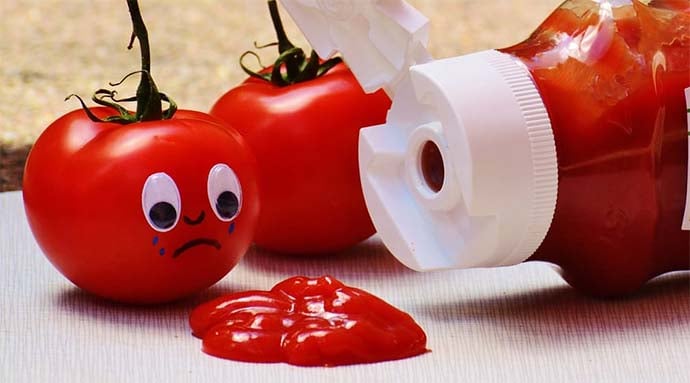 sad tomatoes with ketchup spillage